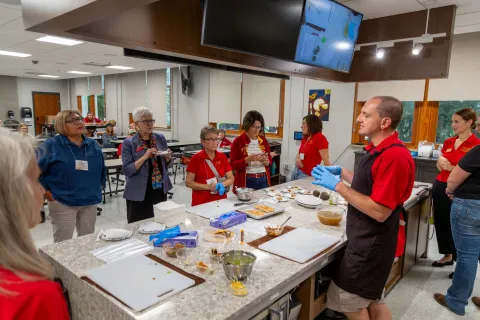 Cyclone Kitchen tour guide instructs participants