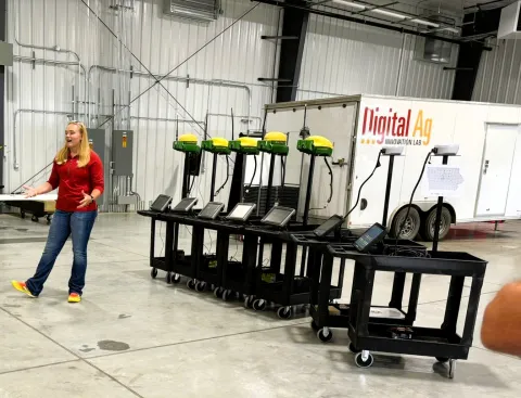 Digital Ag tour guide talks about mobile units provided to high school vocational agriculture teachers
