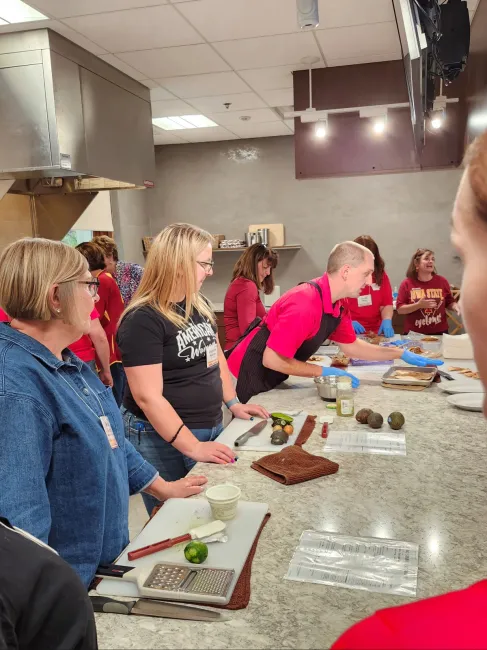 Cyclone Kitchen tour with participants working on knife cuts